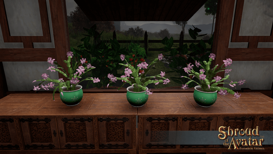 Three pink-flowered cacti in light green pots sit in front of a window looking out on a cold and stormy garden.