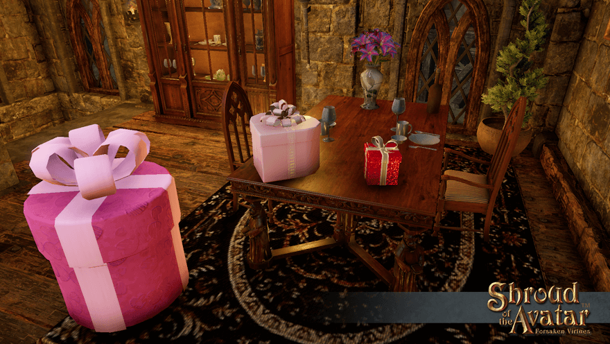A dining table holds place settings for two, a vase of lilies, a small sparkly red gift box, and a medium pale pink heart-shaped box. A large round bright pink box is on the floor next to the table; there's no being subtle trying to hide that one.