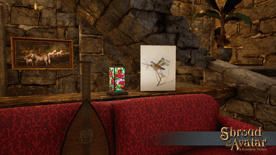 A winter branch holds a pair of birds on the front of a card on the railing behind a couch. Perhaps the evening shall have a musical theme; there's a lute on the couch.