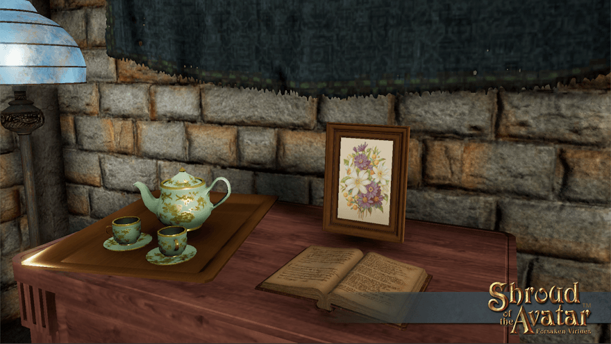 A chest of drawers holds a tea tray, an open book, and a small dark wood desktop picture frame with a white and purple floral print.