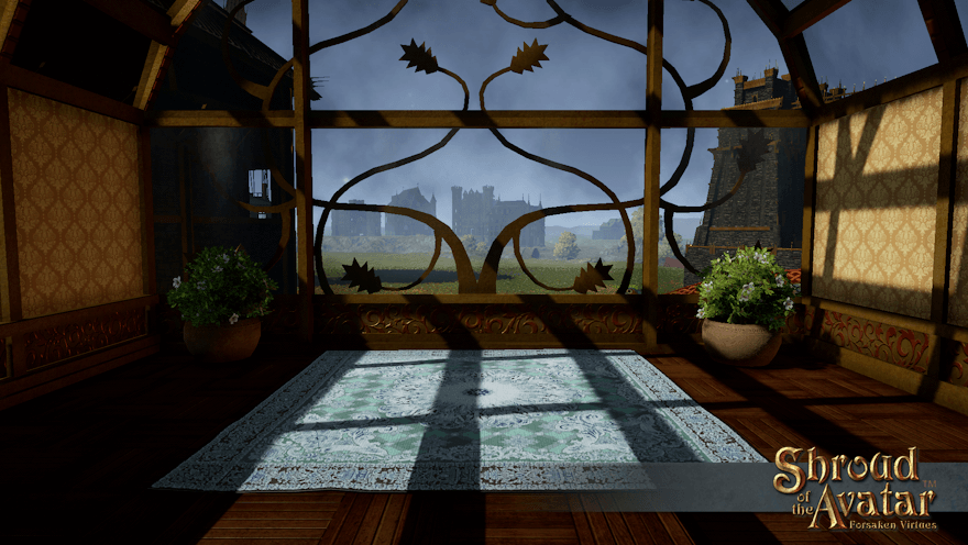 A greenhouse room at the top of a house holds an intricate blue and green rug and a couple of potted azaleas.