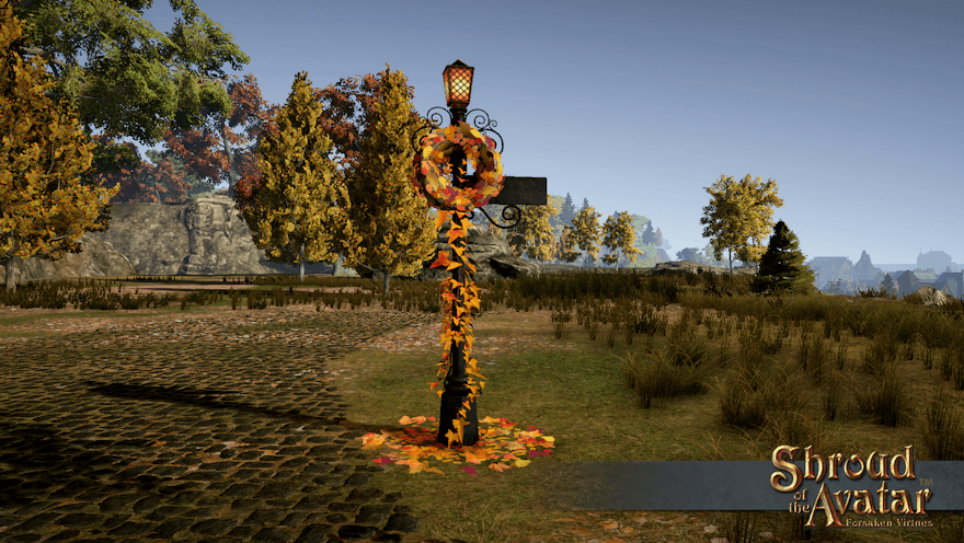 Next to a cobblestone road in Harvest, a dark metal street lamp and sign holds a red and gold autumn leaf wreath.  Leaves also climb the base and litter the ground around it.