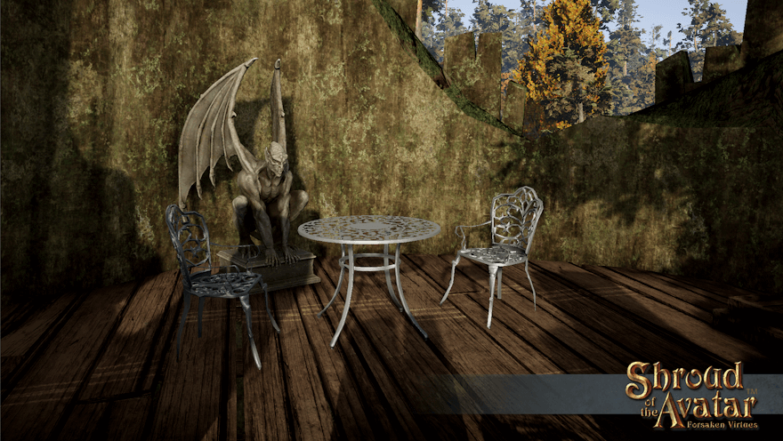 Two silver iron chairs and a winged gargoyle sit around a small matching table in the afternoon Brookside light on a hollow log home's roof deck.